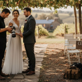 Photographer with couple in Adelaide vineyard