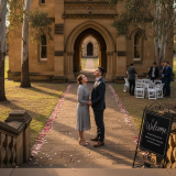 Couple standing outside Adelaide heritage wedding venue