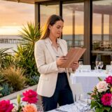 Event planner checking seating at beach venue