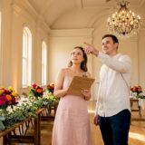 Engaged couple touring rustic wedding venue