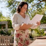 Event planner reviewing timeline at desk