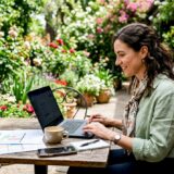 Event planner managing bookings at conference room table