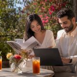 Couple browsing Adelaide wedding venues at home
