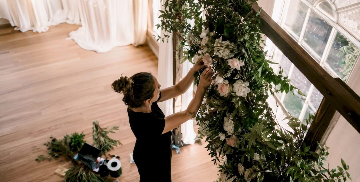 https://adelaideweddingvenues.com/new/wp-content/uploads/2026/08/1786616338526_Stylist-arranging-floral-arch-hero-piece-1260x640.jpeg