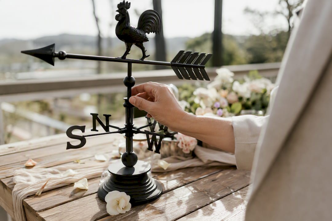 Adelaide wedding weather: your season-by-season guide 1 Hand adjusting analog weather station at wedding venue