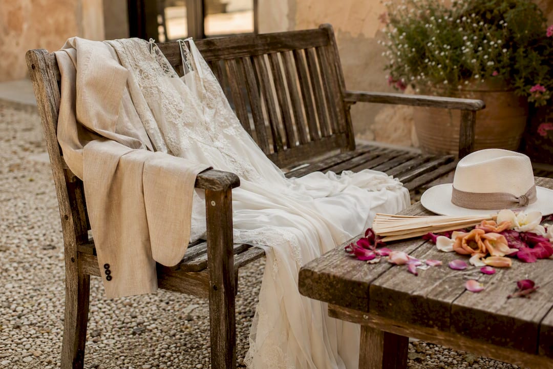 Yes, you can have a heatwave wedding in Adelaide, with a plan 2 Light wedding party clothing on chair