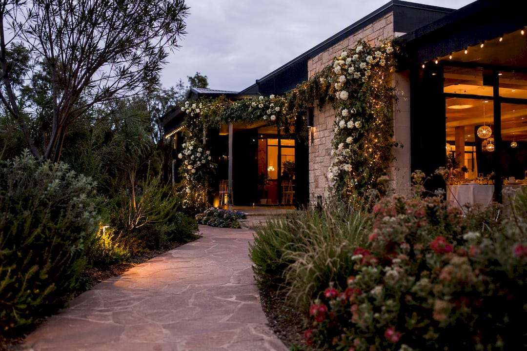 Decide paid or free listings in 5 ROI questions for Adelaide venues 1 Exterior of decorated Adelaide wedding venue at dusk