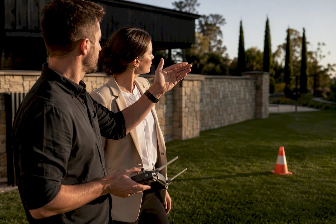 Before You Book: 4 Drone Policy Checks for Adelaide Wedding Venues 1 Photographer and coordinator discussing drone flight area