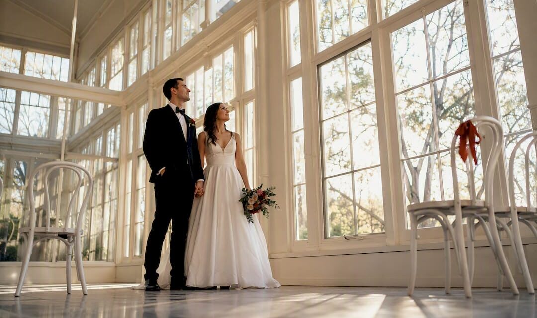 https://adelaideweddingvenues.com/new/wp-content/uploads/2026/09/1788141789189_Couple-beneath-soft-orangery-window-light-1080x640.jpeg